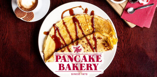 Photo of a dish from The Pancake Bakery with their logo overlaid on top