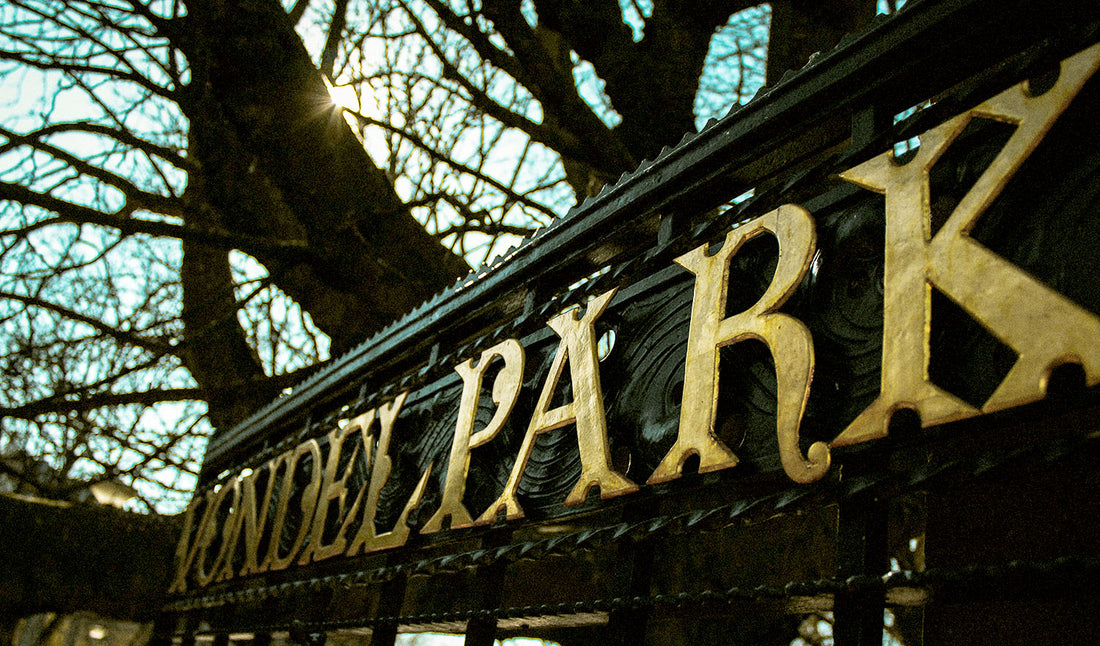 Close-up photo of the ironwork/text "VONDELPARK" on the park gate.